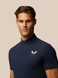 Front view of navy Golf Club Essential Polo for men with Castore logo on left chest and three-button placket.