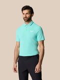 Front view of a man wearing a light aqua Golf Club Essential Polo with a white Castore logo on the chest