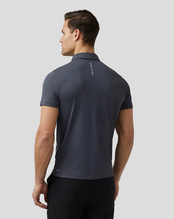 Back view of a dark grey Castore Golf Pinnacle Engineered Polo with a vertical Castore logo on the upper back.
