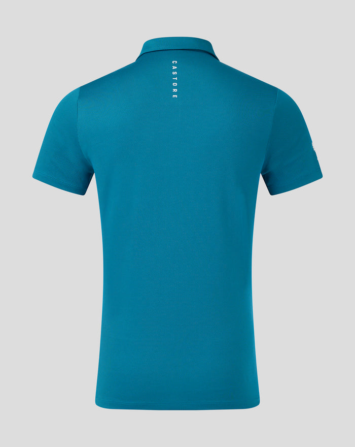 Back view of teal knit golf polo with a structured collar and vertical CASTORE branding running down the center back