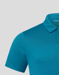 Close-up of teal Pinnacle engineered knit golf polo showing the collar and textured fabric with Castore branding on the chest