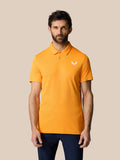 Front view of a man wearing a Mango Golf Pinnacle Polo with a small white logo on the chest.