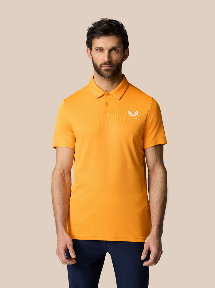 Front view of a man wearing a Mango Golf Pinnacle Polo with a small white logo on the chest.