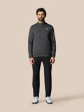 Male model wearing gunmetal Golf Club Classic long sleeve top with stand collar and quarter zip, logo on left chest