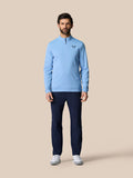 Light blue Golf Club Classic Quarter Zip Top on a male model featuring a stand collar, long sleeves, Protek water resistance, and Castore logo on chest.