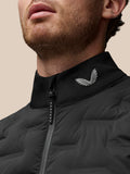 Close up of a black jacket collar with a Castore wing logo and front zipper