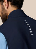 Back of navy gilet neck with vertical Castore branding along the zipper