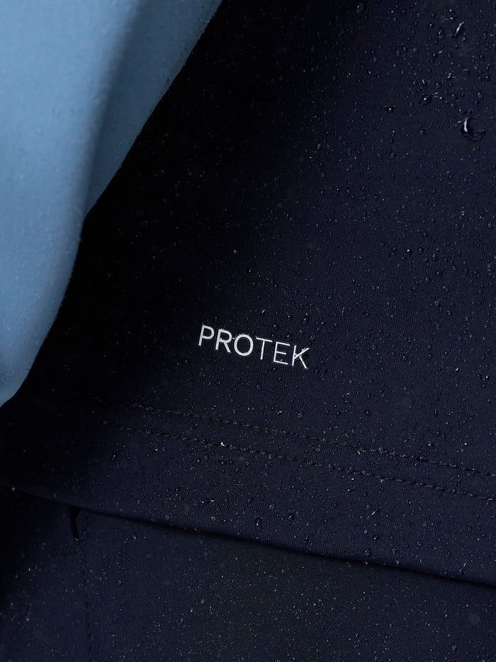 Close-up of navy Pinnacle fabric with Protek branding and raindrops