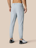 Back view of light grey Golf Pinnacle pants showing rear pocket and Castore logo at right hip