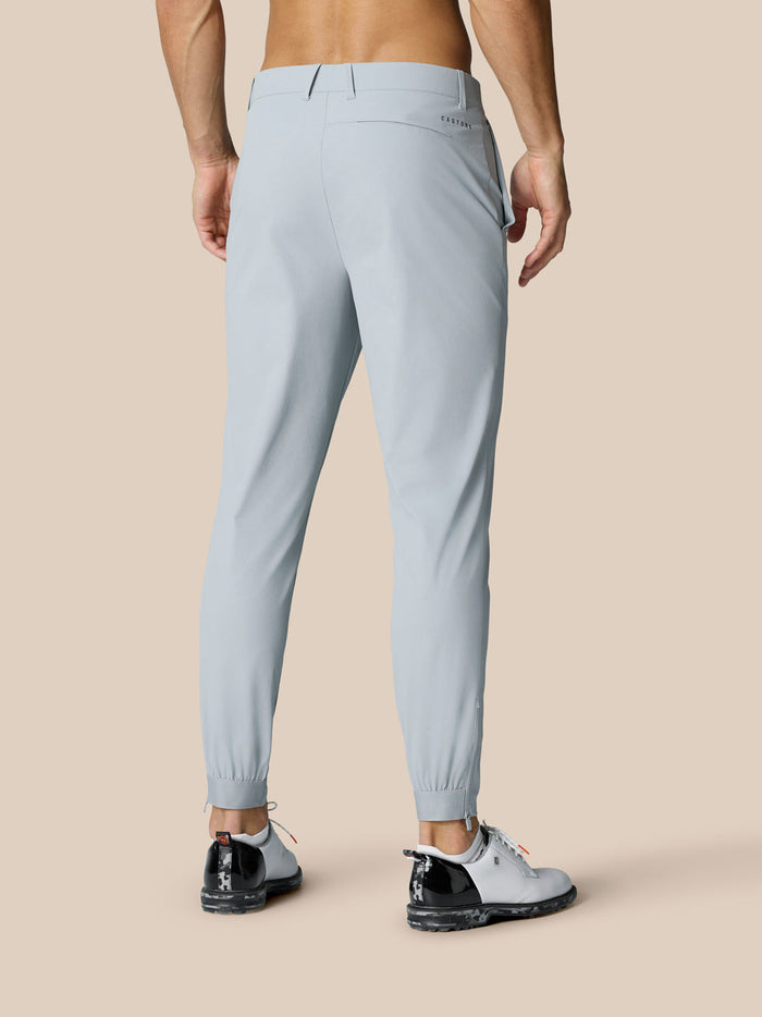 Back view of light grey Golf Pinnacle pants showing rear pocket and Castore logo at right hip