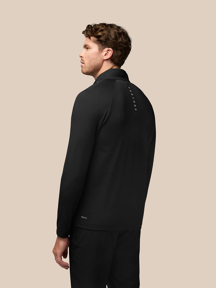 Back view of the black Golf Pinnacle Jas jacket showing a vertical Castore logo along the upper back