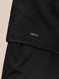 Hem detail of the black Golf Pinnacle Jas showing Protek label