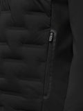 Close-up of the front zipper and zippered pocket on the black Golf Pinnacle Jas