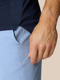 Close-up side view of navy Pinnacle Golf Polo highlighting the hem and side seam for mobility