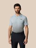 Model wearing Club Grafische Polo in mid gray with an ombre graphic and Castore logo on the chest