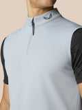 Close up of a light grey Club Halve Rits Gilet with a high collar and half zip, Castore emblem at the neck