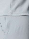 Close-up of light gray fabric with water droplets showing ProTek water repellency.