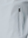 Vertical zip pocket detail on the side of the gray Golf Pinnacle woven jacket with a branded zipper pull.