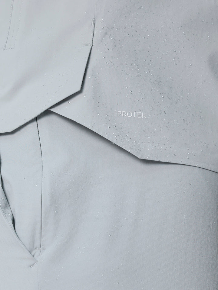 Close-up of light gray ProTek fabric with water droplets and ProTek logo.