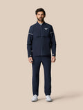 Male model wearing a navy Golf Pinnacle woven jacket with full zip and ventilated panels