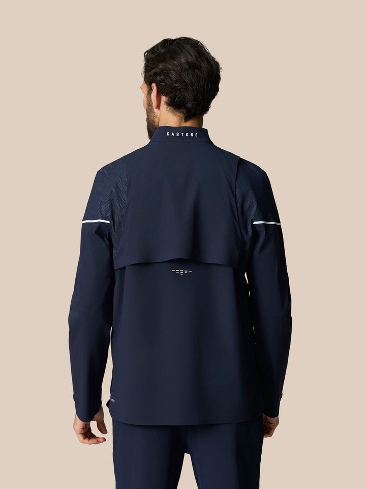 Back view of navy Golf Pinnacle woven jacket showing CASTORE branding on the collar and mesh shoulder panels