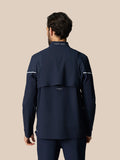 Back view of navy Golf Pinnacle woven jacket showing CASTORE branding on the collar and mesh shoulder panels