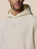 Close up of oatmeal hoodie showing central Castore logo embroidery on chest and soft fleece fabric