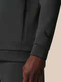 Close-up of sleeve cuff on gunmetal sweatshirt showing the Castore wing logo