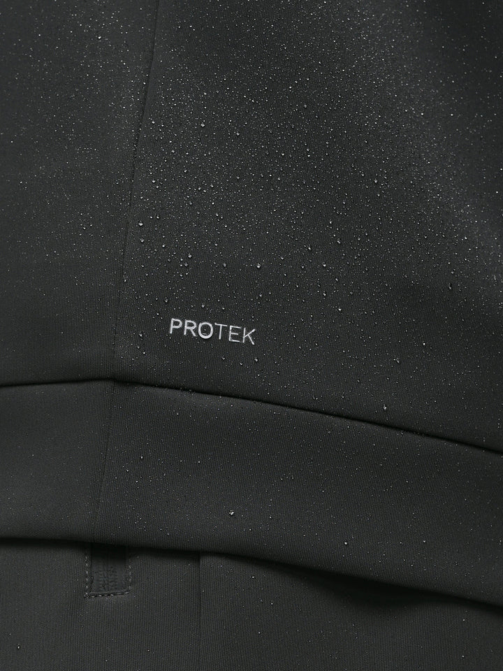 Close up of gunmetal sweatshirt chest with ProTek branding and water droplets on the fabric.