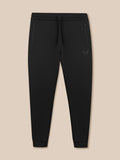 Flat lay of black Flex Joggers with drawstring waistband zip pockets and Castore logo on the thigh