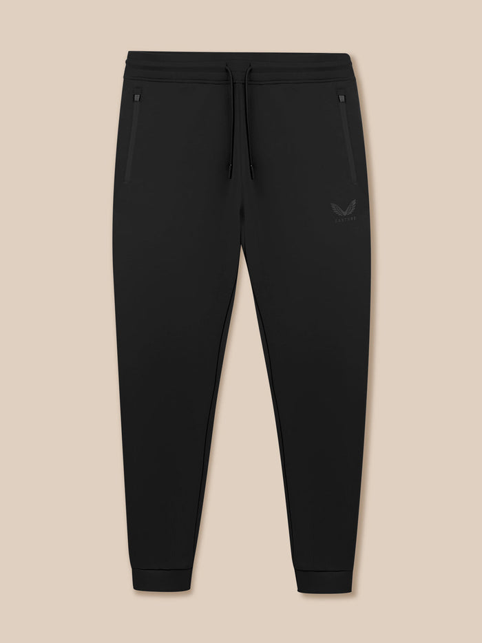 Flat lay of black Flex Joggers with drawstring waistband zip pockets and Castore logo on the thigh