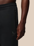 Castore logo with wing emblem on the lower leg of black joggers