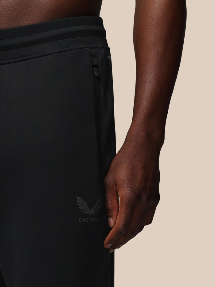 Castore logo with wing emblem on the lower leg of black joggers