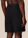 Back view of black Castore Adapt shorts highlighting the branded elastic waistband