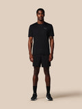 Male model in black Adapt Training Short with ProTek water resistance jacquard waistband and zipped pockets Castore branding on left leg