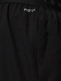 Close-up of black Adapt Training Short fabric with water droplets and ProTek branding on the waistband