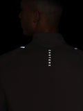 Rear view of the deep taupe Castore Apex Quarter Zip Top showing vertical CASTORE branding down the back
