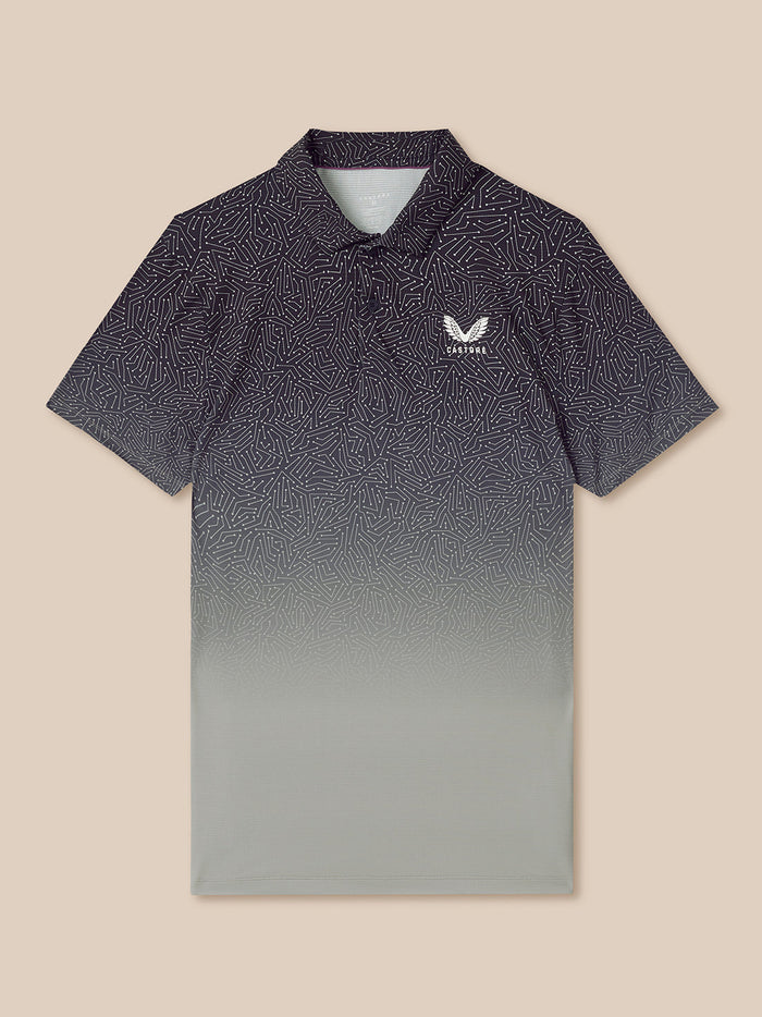 Mens navy golf polo with a white Castore logo on the chest and a gradient pattern from dark to light