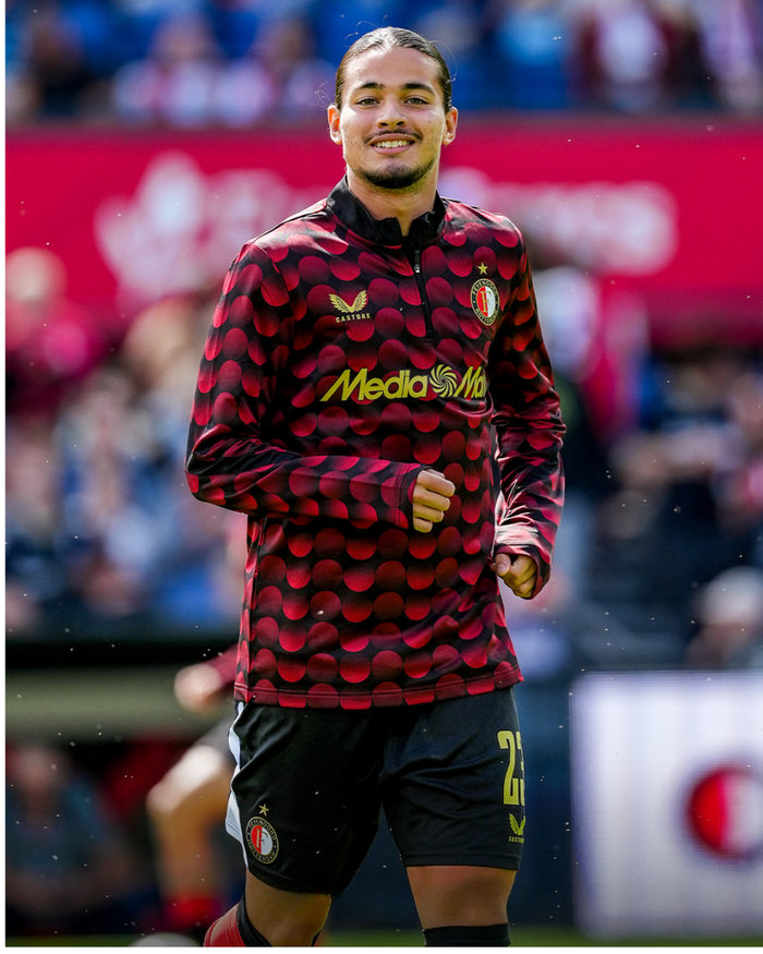 Feyenoord home matchday midlayer top 2025-26 worn by a player during warm-up on the pitch.