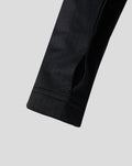 Close up of the black sleeve cuff with a small slit on the junior Feyenoord training midlayer