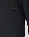 Close-up of a zipped side pocket on the black Feyenoord training jacket.