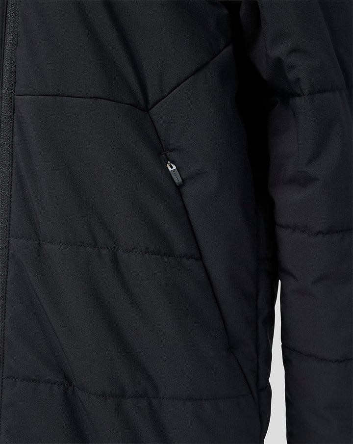 Close-up of black padded Feyenoord junior training jacket with zip pocket.