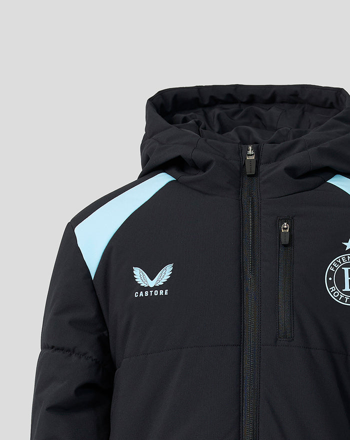 Upper chest close-up of navy Feyenoord junior jacket showing crest and Castore emblem with light blue shoulder stripe