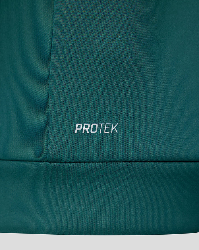 Close-up of teal green fabric with PROTEK branding on the Feyenoord Travel hoodie.