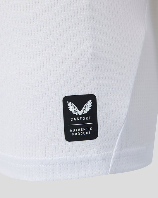 Close up of white Feyenoord jersey fabric with Castore authentic product patch.