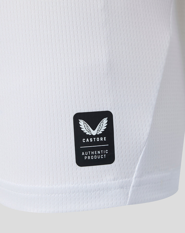 Close up of white Feyenoord jersey fabric with Castore authentic product patch.