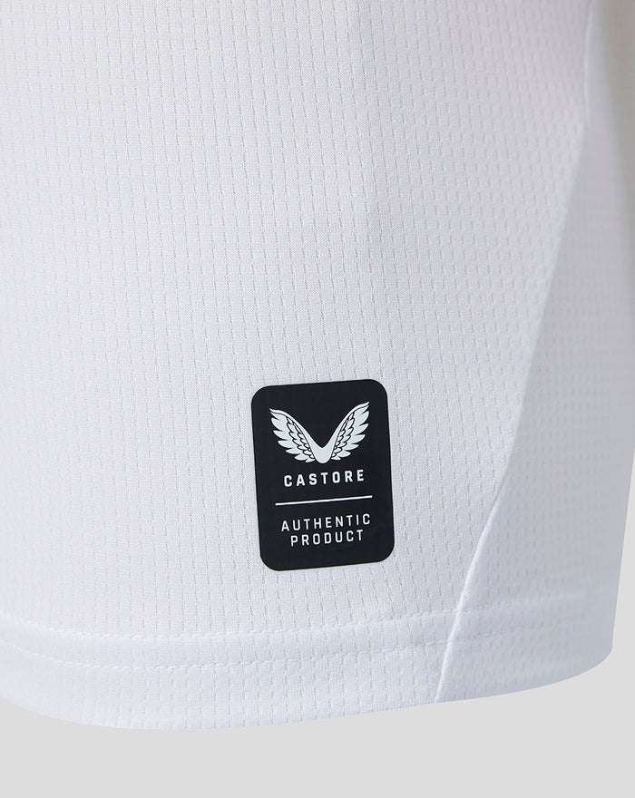 Close up of white Feyenoord jersey fabric with Castore authentic product patch.