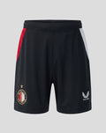 Front view of black Feyenoord junior home shorts with red and white side panels; left leg crest, right leg Castore logo.