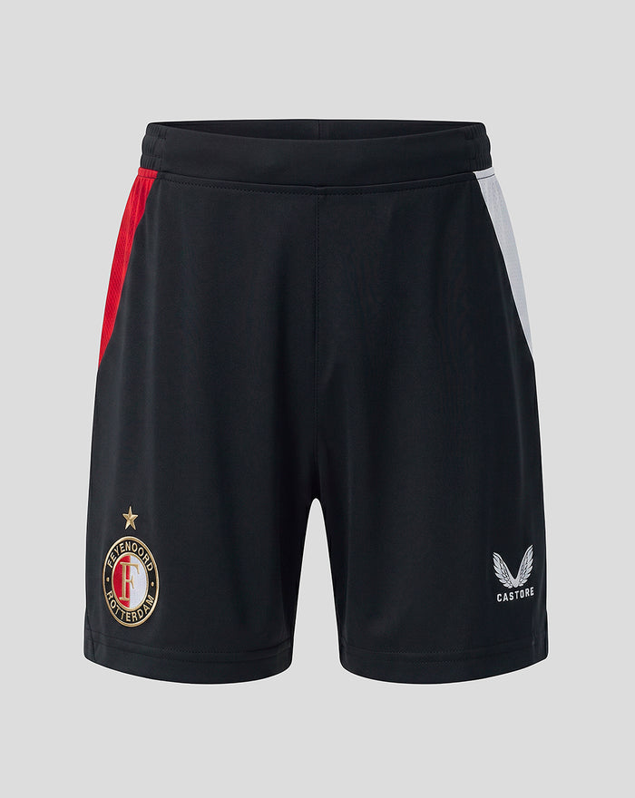 Front view of black Feyenoord junior home shorts with red and white side panels; left leg crest, right leg Castore logo.