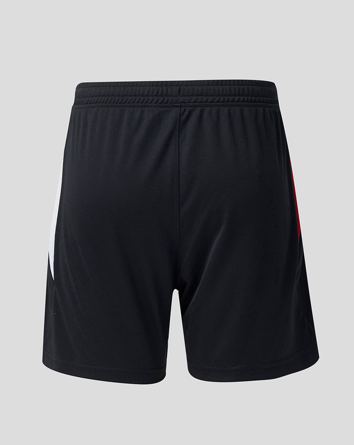 Back view of black Feyenoord junior home shorts with white side panel and red trim.
